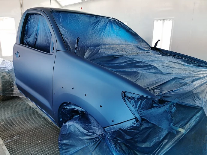 Vehicle masked and prepared for respraying